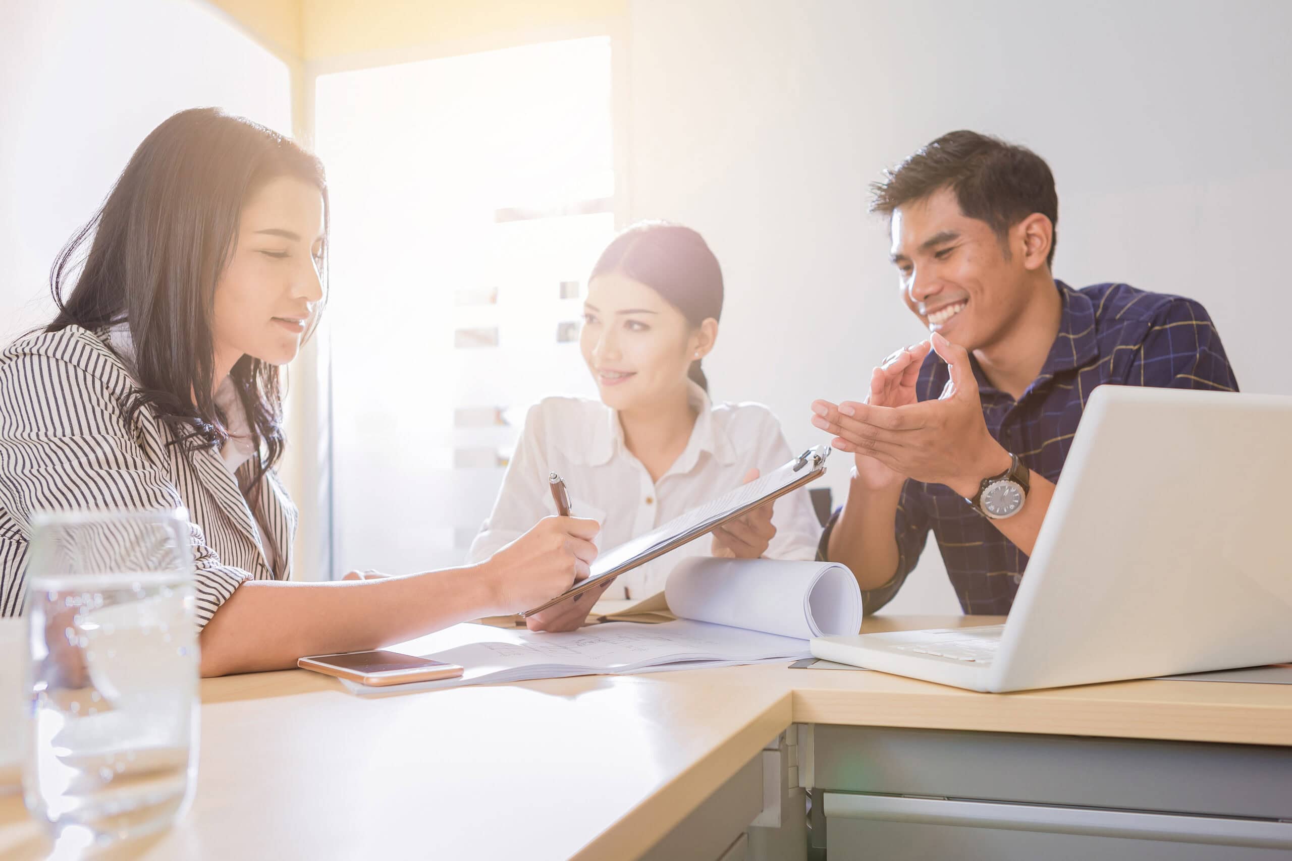 businesswoman sign in contract with partnership in meeting
